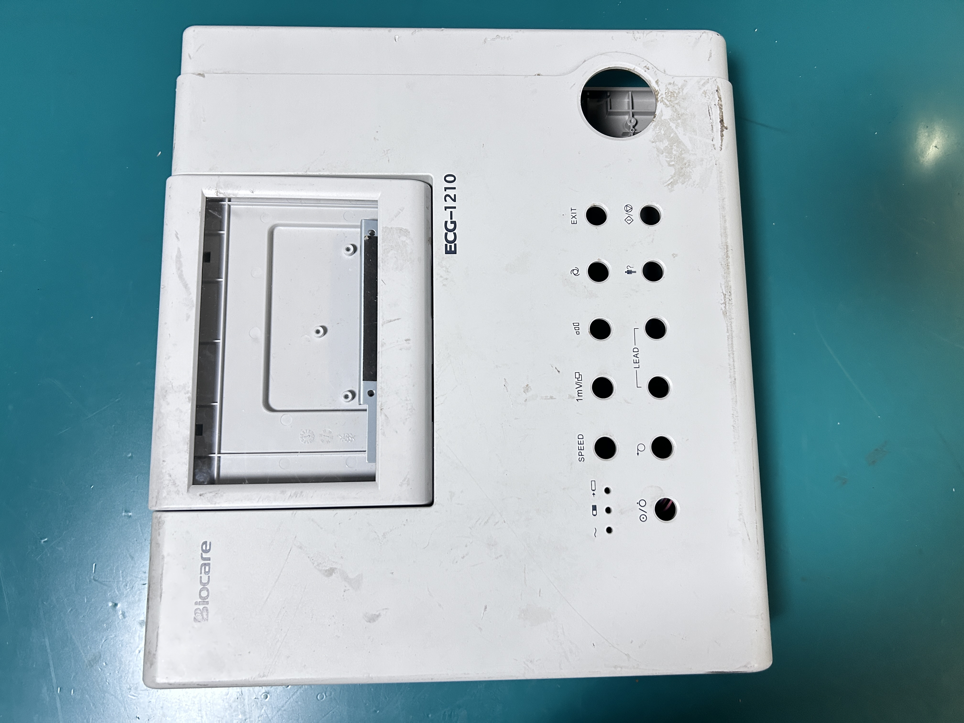 The complete Biocare ECG-1201 electrocardiograph set includes the display screen, printer, and motor assembly
