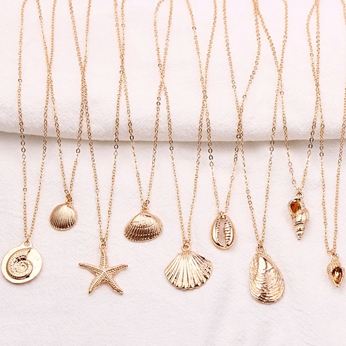 gold cowrie shell necklace