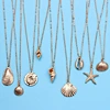 gold cowrie shell necklace