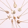 gold cowrie shell necklace