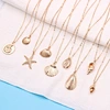 gold cowrie shell necklace