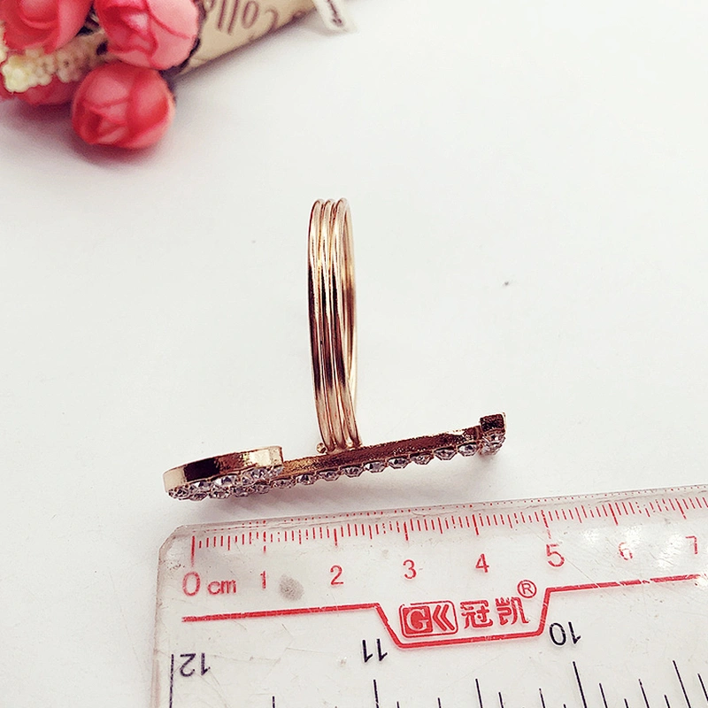 Latest design plating gold rhinestone napkin ring crystal diamond napkin ring for Wedding table centerpieces