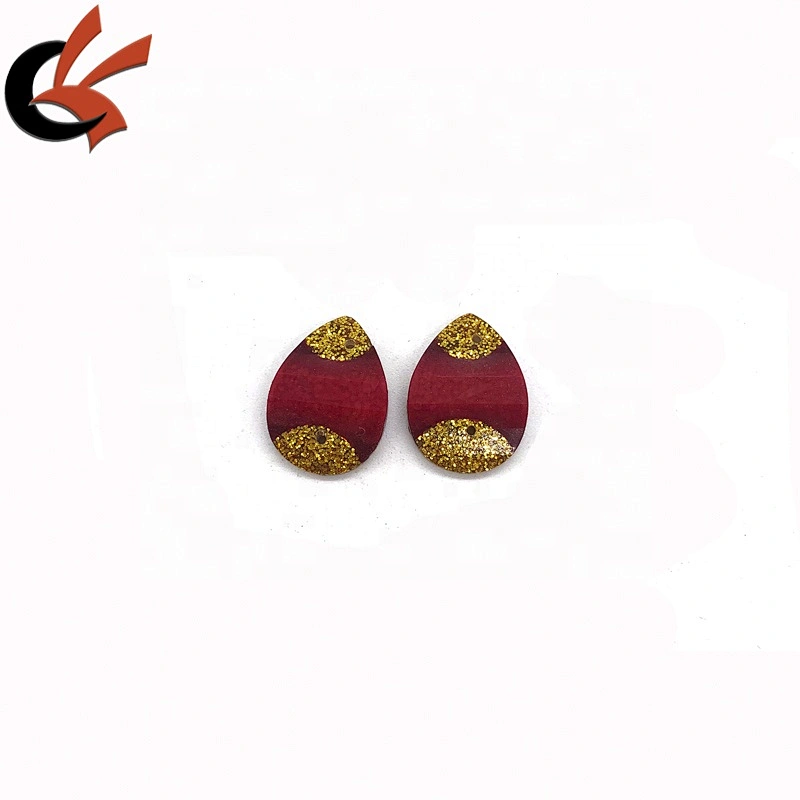 Red and gold glitter glue on resin loose stones