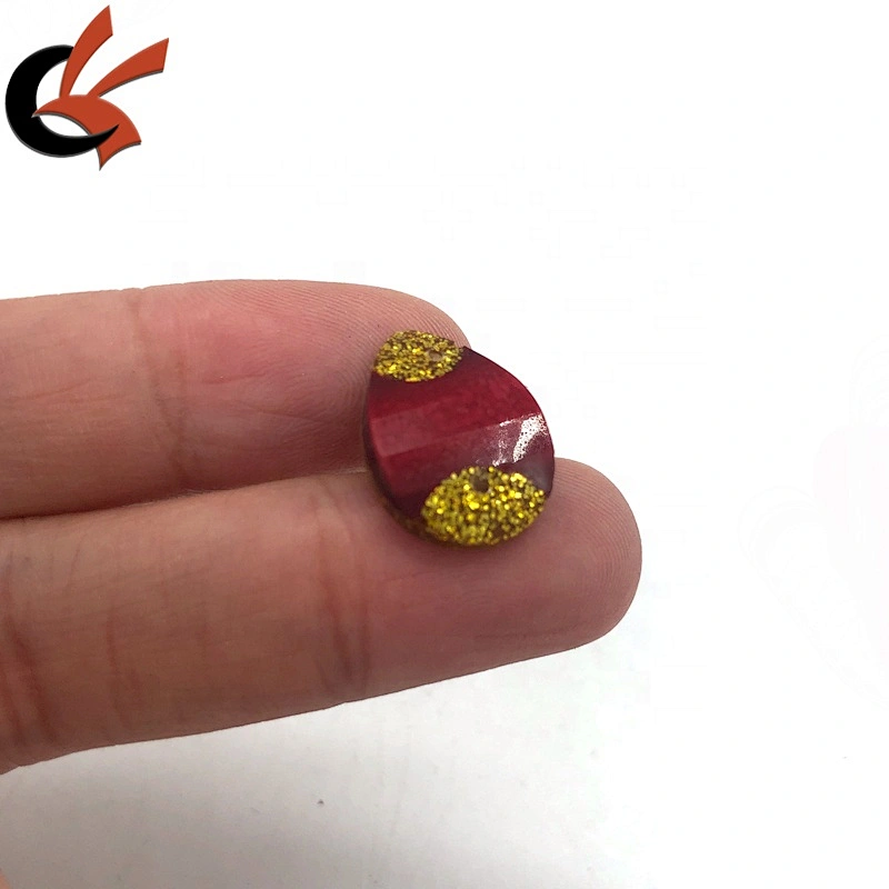 Red and gold glitter glue on resin loose stones