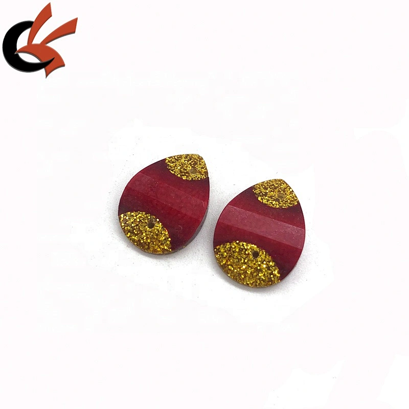 Red and gold glitter glue on resin loose stones