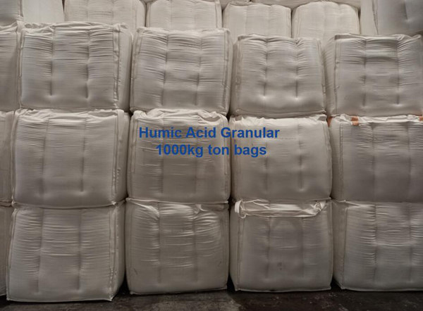 Bulk humic acid granules packed in 1-ton jumbo bags stored safely inside our dry factory warehouse.