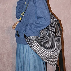 Foldable black poly fabric mesh drawstring sports bag with front zipper pocket