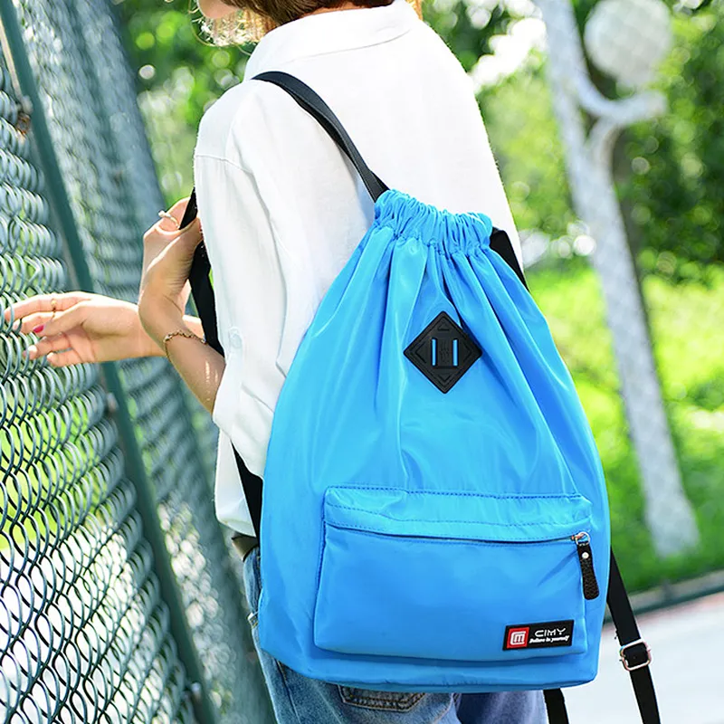 Small waterproof nylon drawstring beach backpack bag with front zipper pocket
