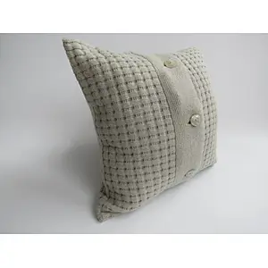 Grey  knit  cushion with buttons