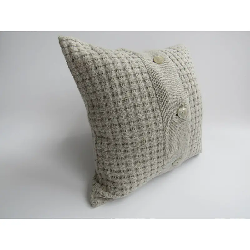 Grey  knit  cushion with buttons