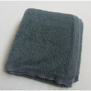 SOLID KNITTED BLANKET WITH RIB ON THE EDGE