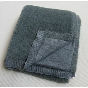 SOLID KNITTED BLANKET WITH RIB ON THE EDGE