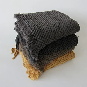 solid acrylic knit woven blanket with tassels