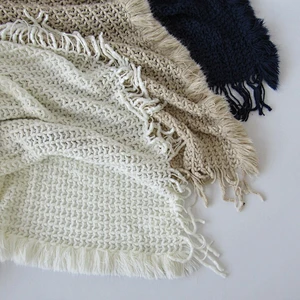 solid knit acrylic woven blanket with tassels