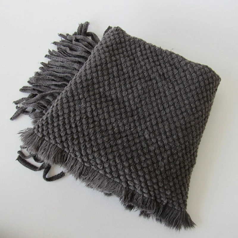 solid acrylic knit woven blanket with tassels