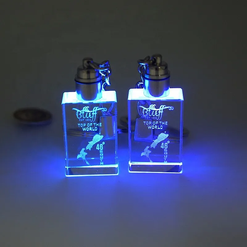 Wholesale custom souvenirs 3d oval laser engraved/engraving glass rhinestone car logo led crystal keychain with box