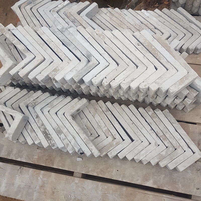White Concrete with Clay Thin Brick Veneer Corners