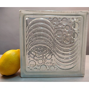 A hollow glass block with wavy water droplets