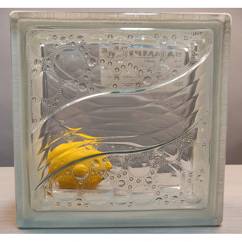 A hollow glass block with wavy water droplets