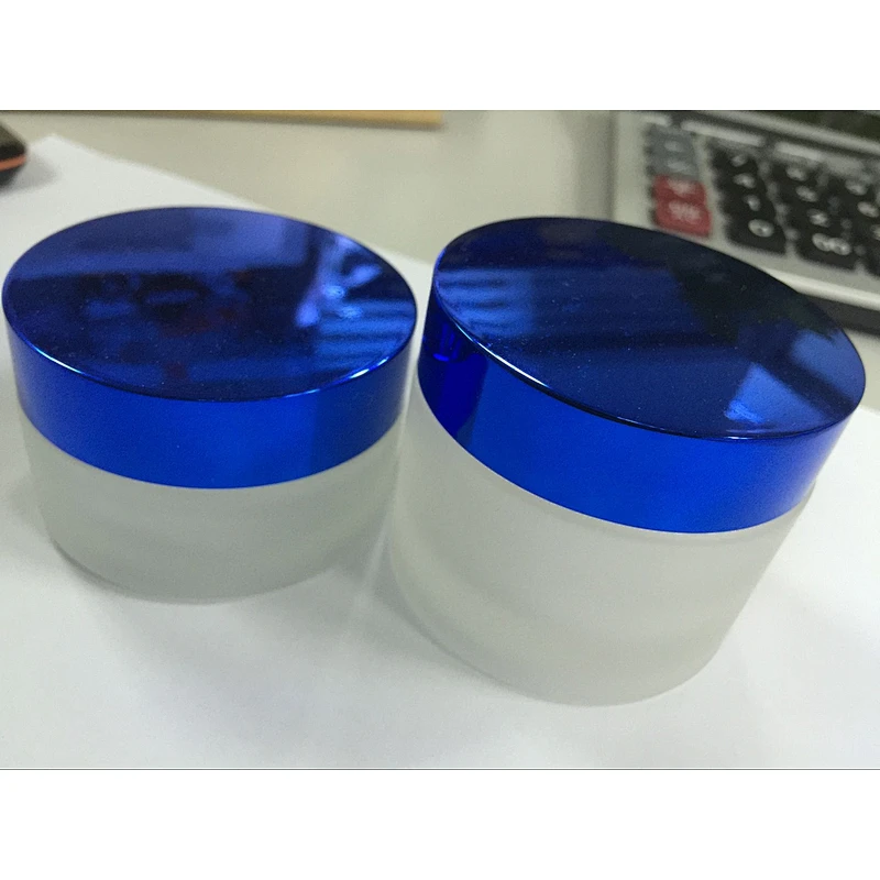Glass cosmetic jar with metallic lid