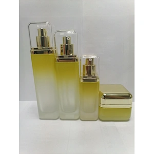 Custom empty glass round clear packaging bottle cosmetic lotion bottle