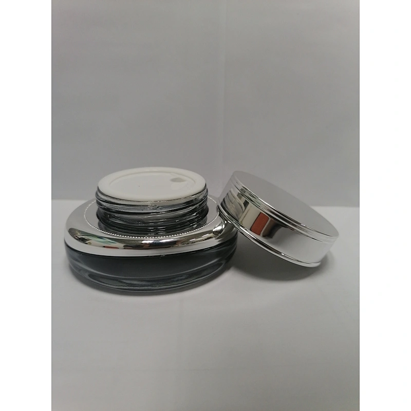 low price with good quality glass cosmetic empty round silver  pump bottles for skincare with  with light silver lid packaging