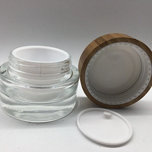 2022 new style eco-friendly bamboo cosmetic glass bottle with linner , bamboo cap engraving logo jar