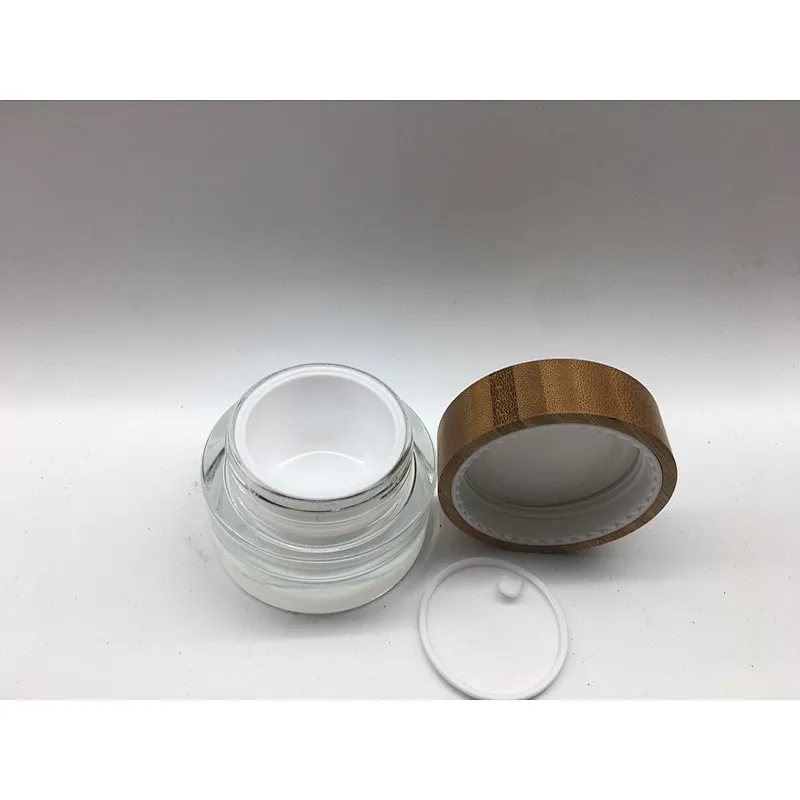 2022 new style eco-friendly bamboo cosmetic glass bottle with linner , bamboo cap engraving logo jar