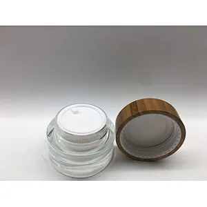 2022 new style eco-friendly bamboo cosmetic glass bottle with linner , bamboo cap engraving logo jar
