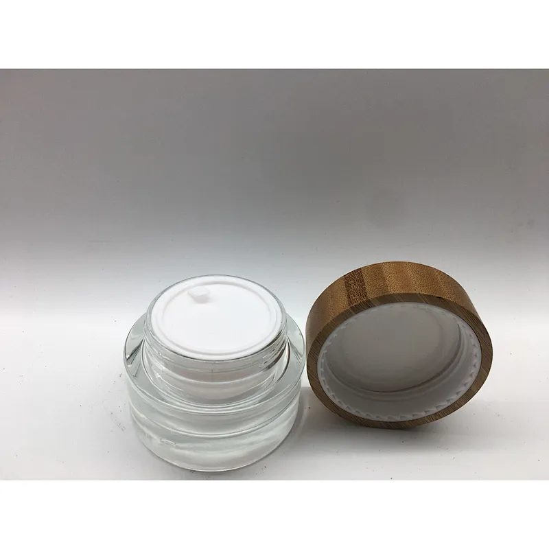 2022 new style eco-friendly bamboo cosmetic glass bottle with linner , bamboo cap engraving logo jar