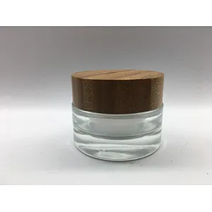 2022 new style eco-friendly bamboo cosmetic glass bottle with linner , bamboo cap engraving logo jar