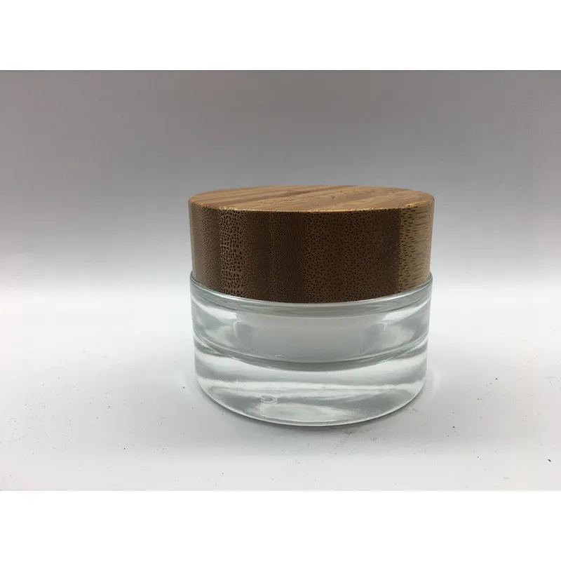 2022 new style eco-friendly bamboo cosmetic glass bottle with linner , bamboo cap engraving logo jar