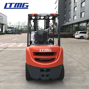 Forklift with bale clamp attachment