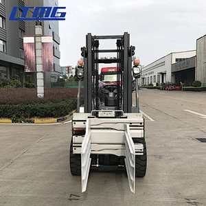 Forklift with bale clamp attachment