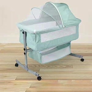 Portable Multifunction Adjustable Height Wheels Rocking Metal Co-Sleeper Bedside Baby Crib Bed With Storage Mosquito Net Canopy