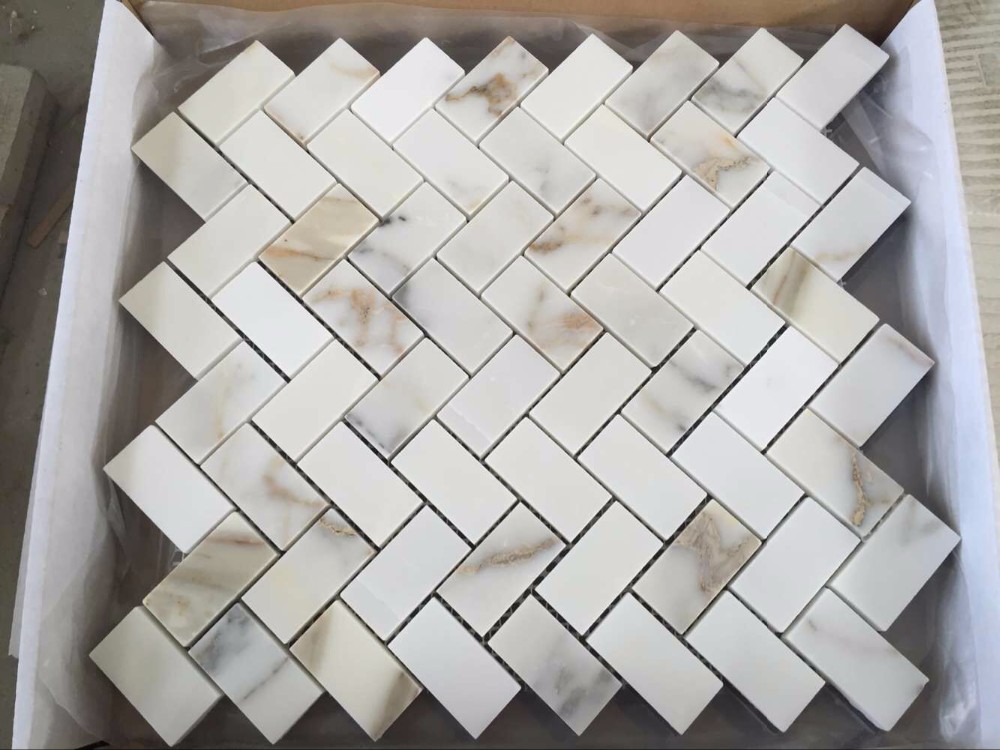 calacatta gold herringbone mosaic.jpg