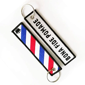 Black embroidered woven keychain with your logo