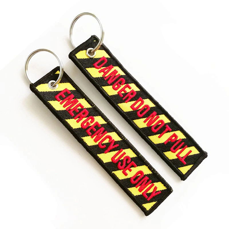 Black embroidered woven keychain with your logo