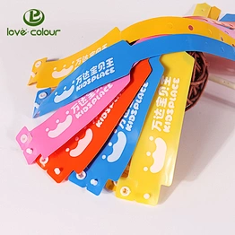 Vinyl waterproof wristband with a one-time use locking snap