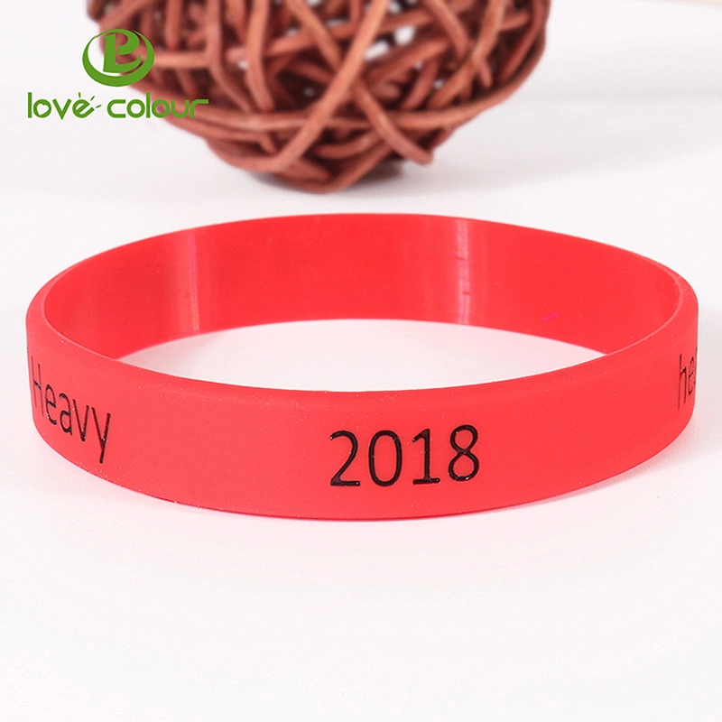 Custom red color debossed silicone wristbands filled with black logo