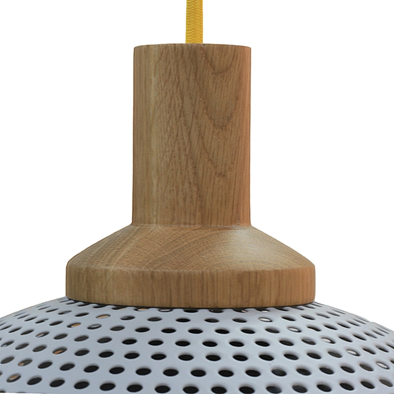 Perforated metal shade and globe glass shade pendant lamp
