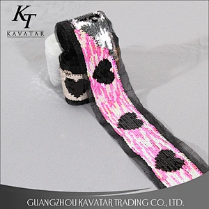 Double face different color sequin trim with motif