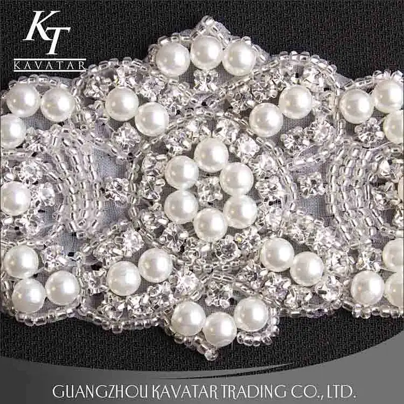 A lot of pearls and crystal sew on voile fabric for wedding dress accessories
