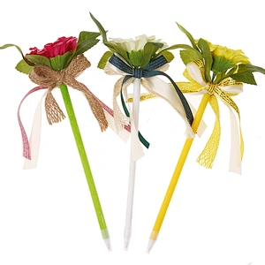 a flower with a bow ball pen