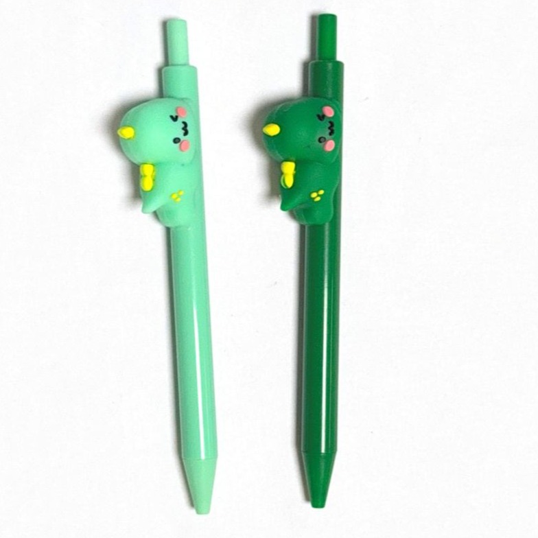 click pen with a dinosaur plush on the side