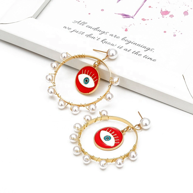 Jump ring hook eye of demon with pearls around earring earrings