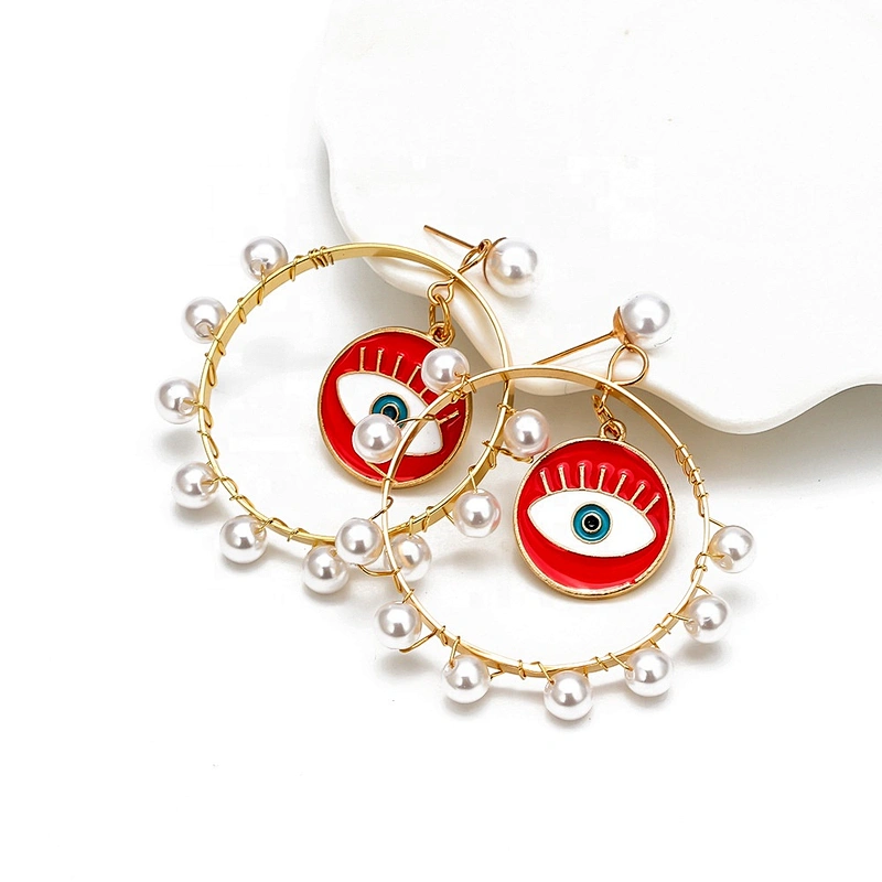 Jump ring hook eye of demon with pearls around earring earrings