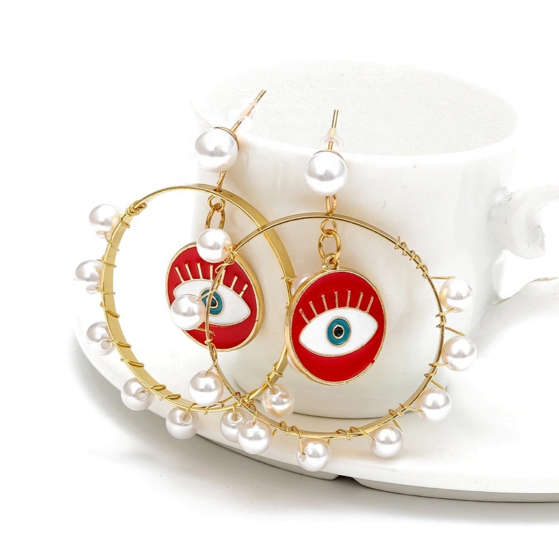Jump ring hook eye of demon with pearls around earring earrings
