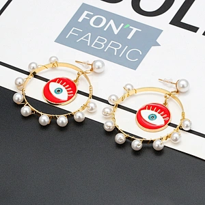 Jump ring hook eye of demon with pearls around earring earrings