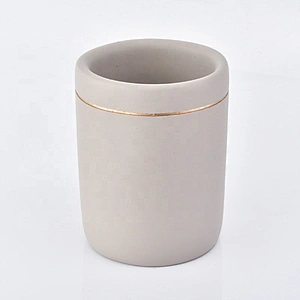 grey concrete bath room accessories with lotion bottles dispenser toothbrush holder